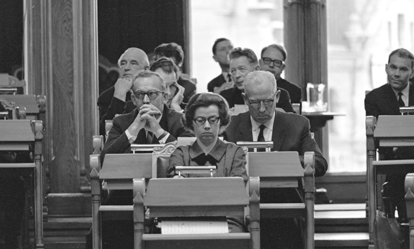 MPs in the Storting Chamber, October 1965. Elisabeth Schweigaard Selmer, Norway’s first female Minister of Justice is sitting in the front row. Photo: Johan Brun / Norsk Folkemuseum. 